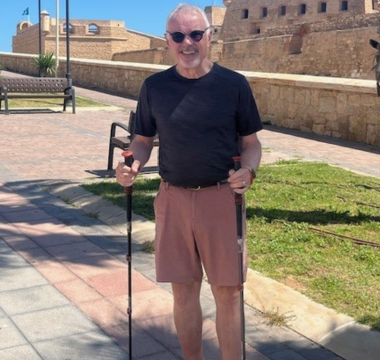 Tom Dobrinski holding walking poles in picture